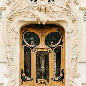 Ornate golden doorway in Paris – elegant architecture art print, historic France wall decor.