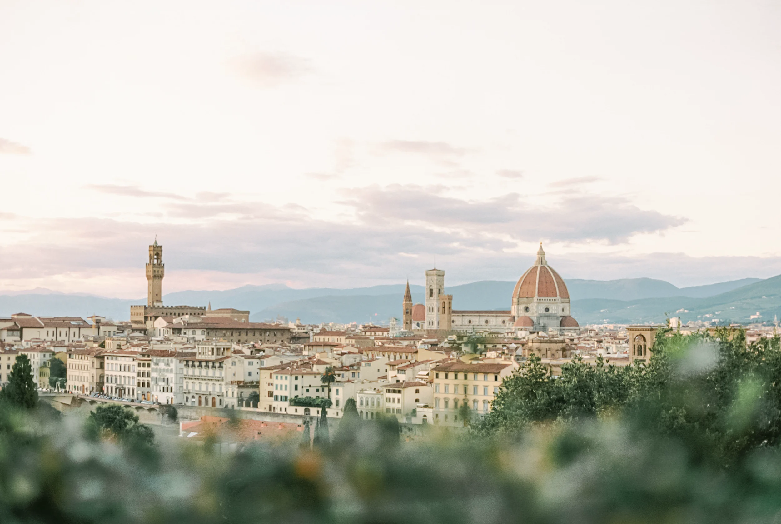 Aerial view of Florence, Italy with the Duomo at sunset.