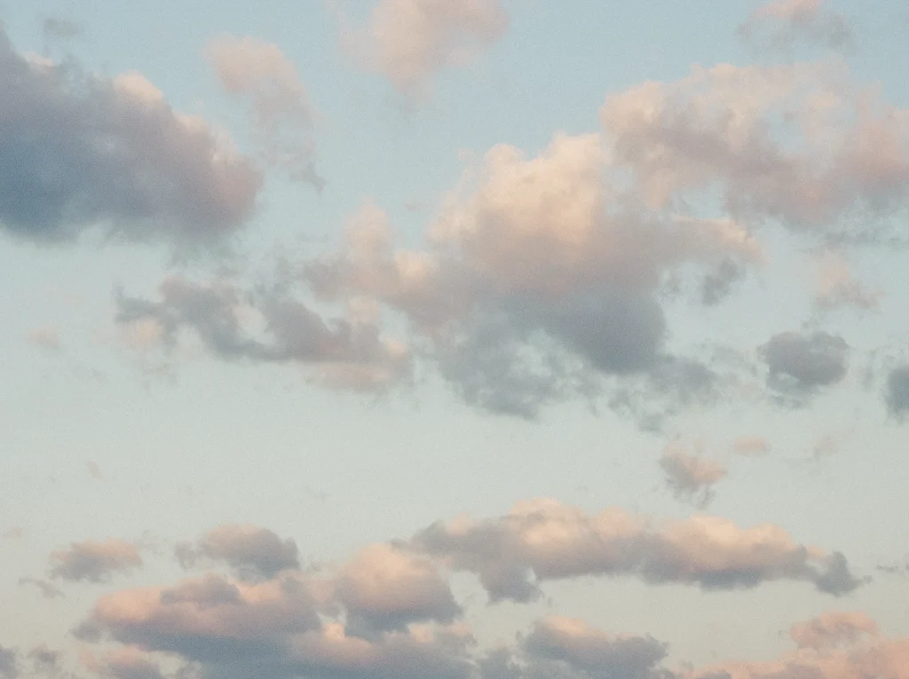 Soft pastel sky with cotton clouds – minimalist nature photography, fine art wall print.