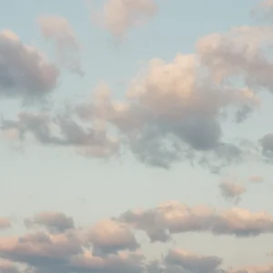Soft pastel sky with cotton clouds – minimalist nature photography, fine art wall print.